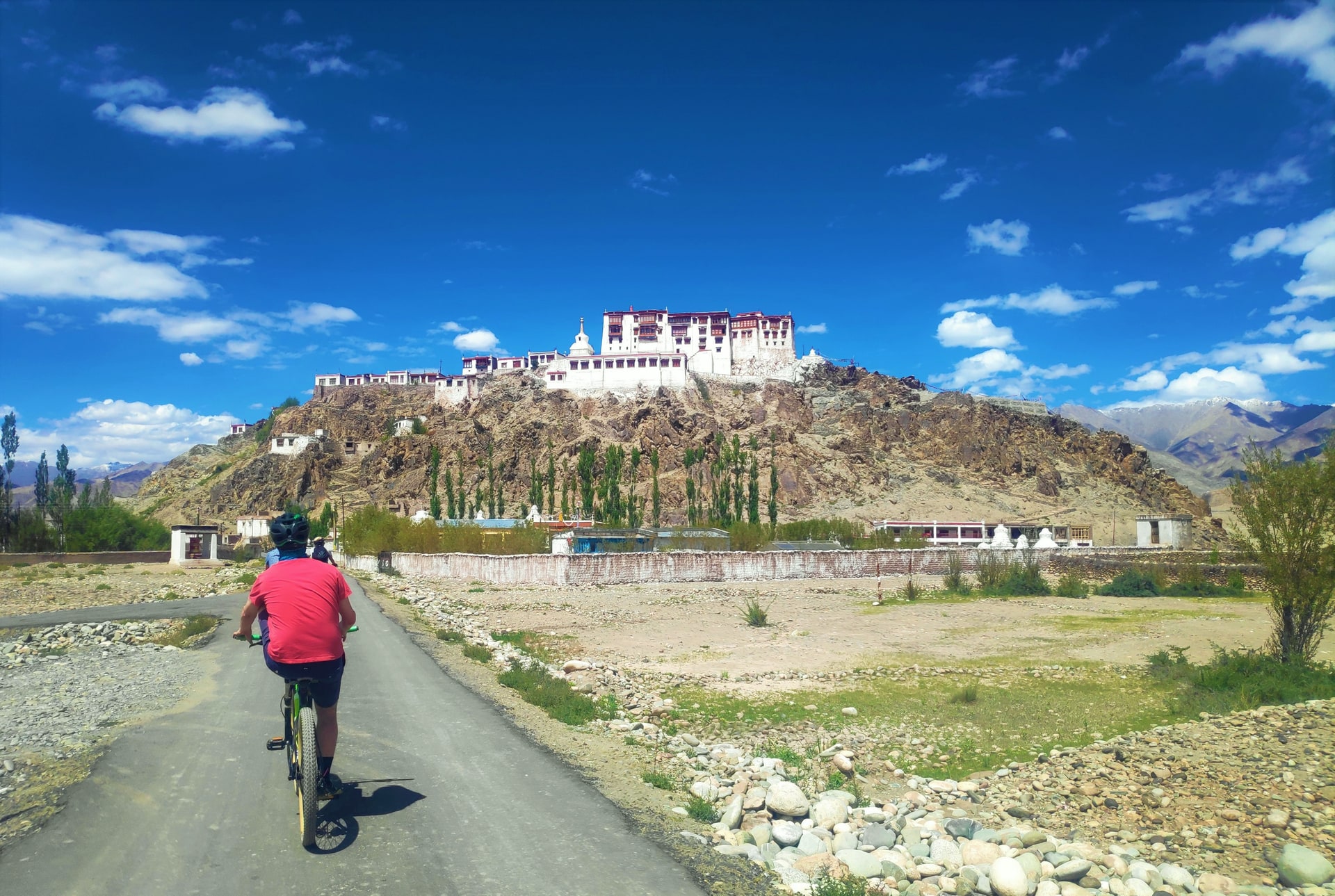 Cycling past Stakna Monastery